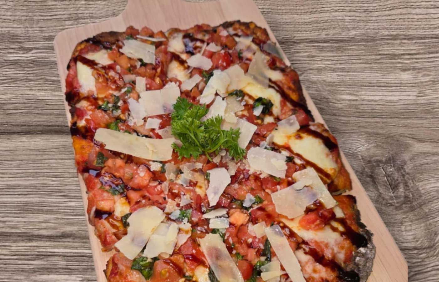 Roman style pizza topped with parmesan cheese served at Matera Grill and Italian Restaurant in Escanaba, MI