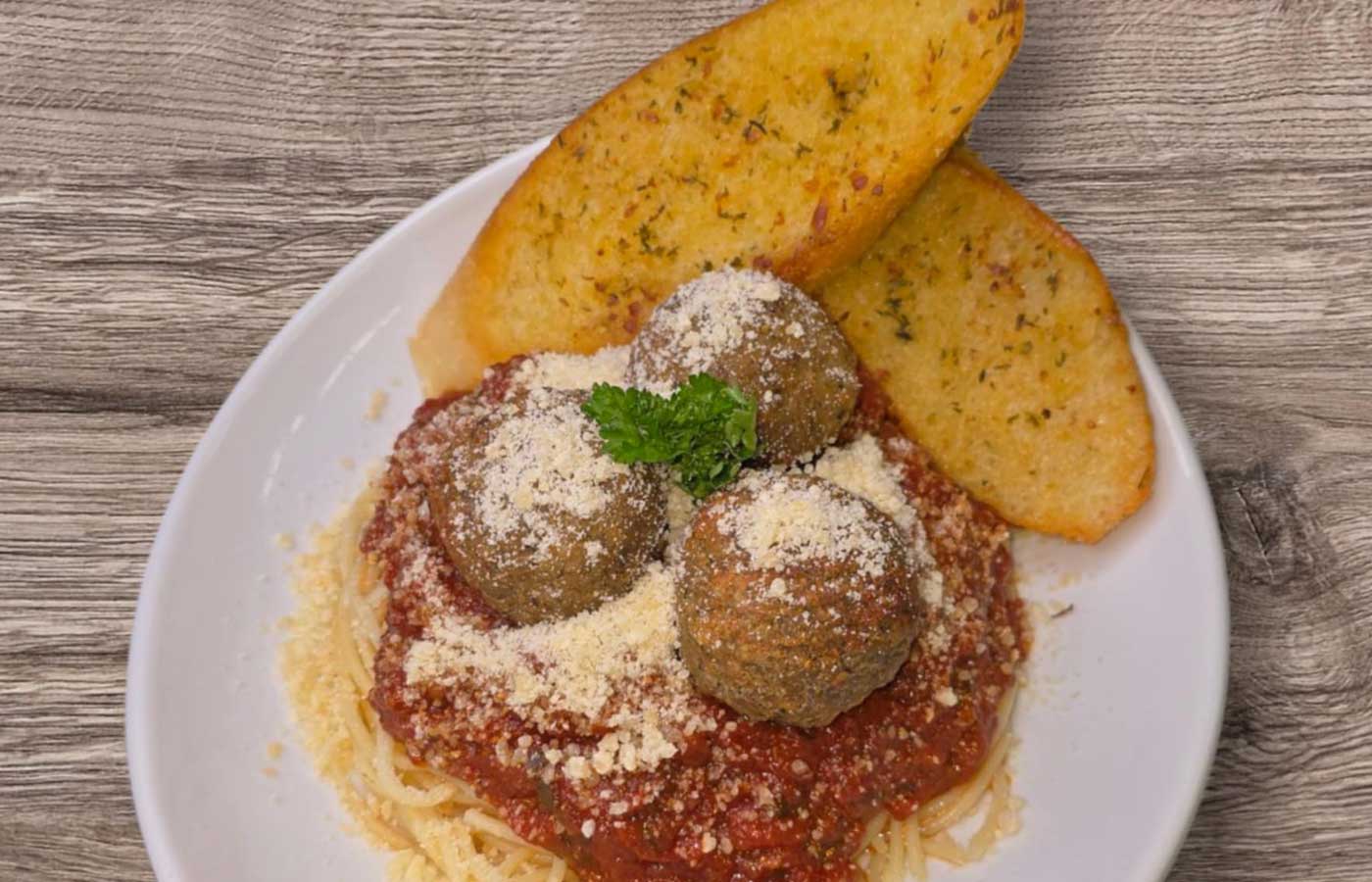 Three meatball spaghetti with garlic bread served at Matera Grill and Italian Restaurant in Escanaba, MI