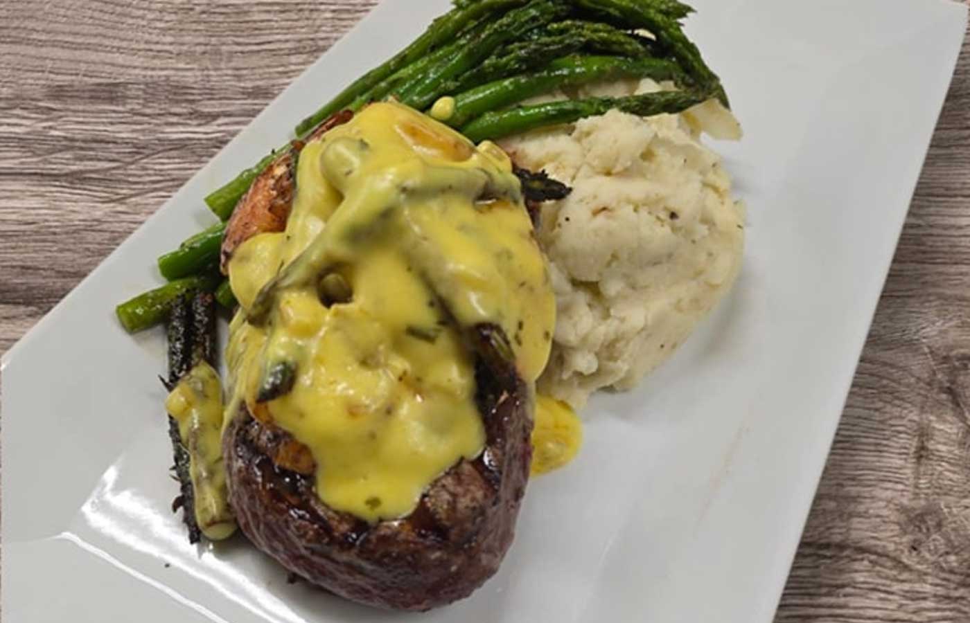 Steak oscar with mashed potatoes and asparagus served at Matera Grill and Italian Restaurant in Escanaba, MI