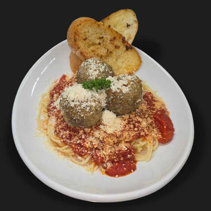 Three meatball spaghetti with garlic bread served at Matera Grill and Italian Restaurant in Escanaba, MI Three meatball spaghetti with garlic bread served at Matera Grill and Italian Restaurant in Escanaba, MI