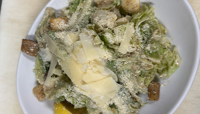 Caesar salad from Matera Italian Menu Pizza Pasta & More in Escanaba, served with fresh toppings.