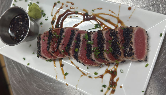 Sliced seared tuna with black sesame, wasabi, and soy at Matera Italian Menu in Escanaba.